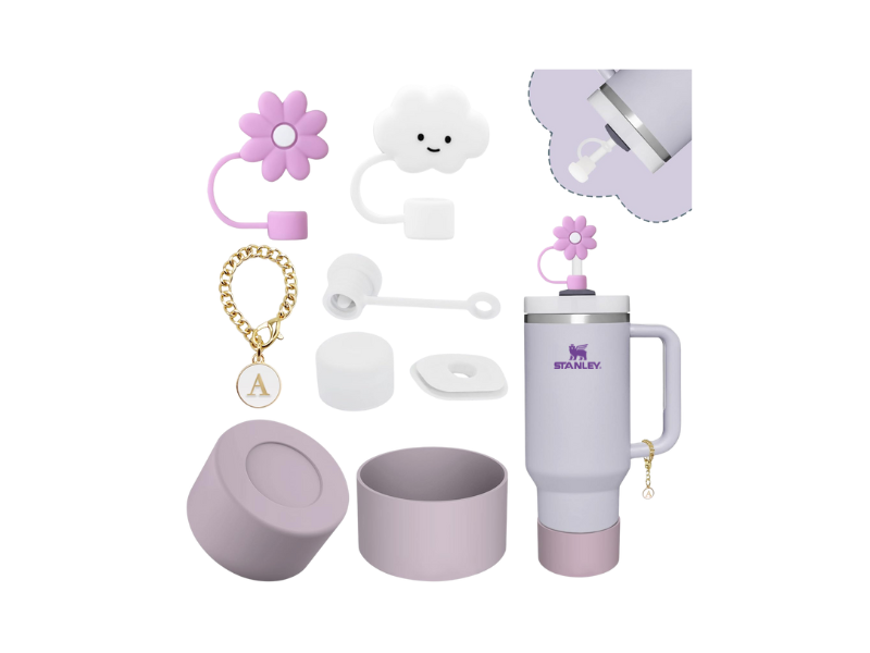 Stanley cup accessories set including lavender boot cover, straw toppers shaped like a flower and cloud, keychain, and straw cleaner displayed with a lavender Stanley tumbler.